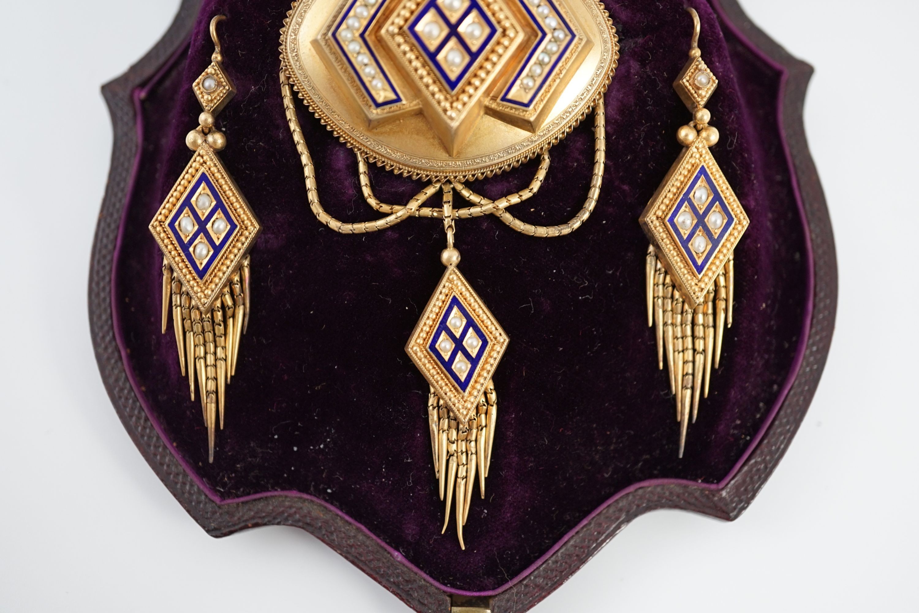 A cased Victorian gold, seed pearl and blue enamel parure